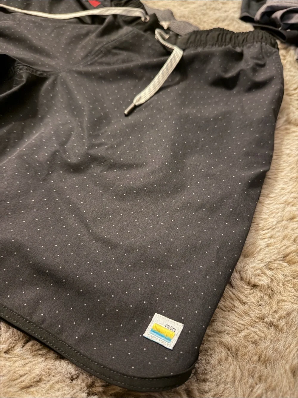 Vuori Black Athletic Shorts with Red Accent